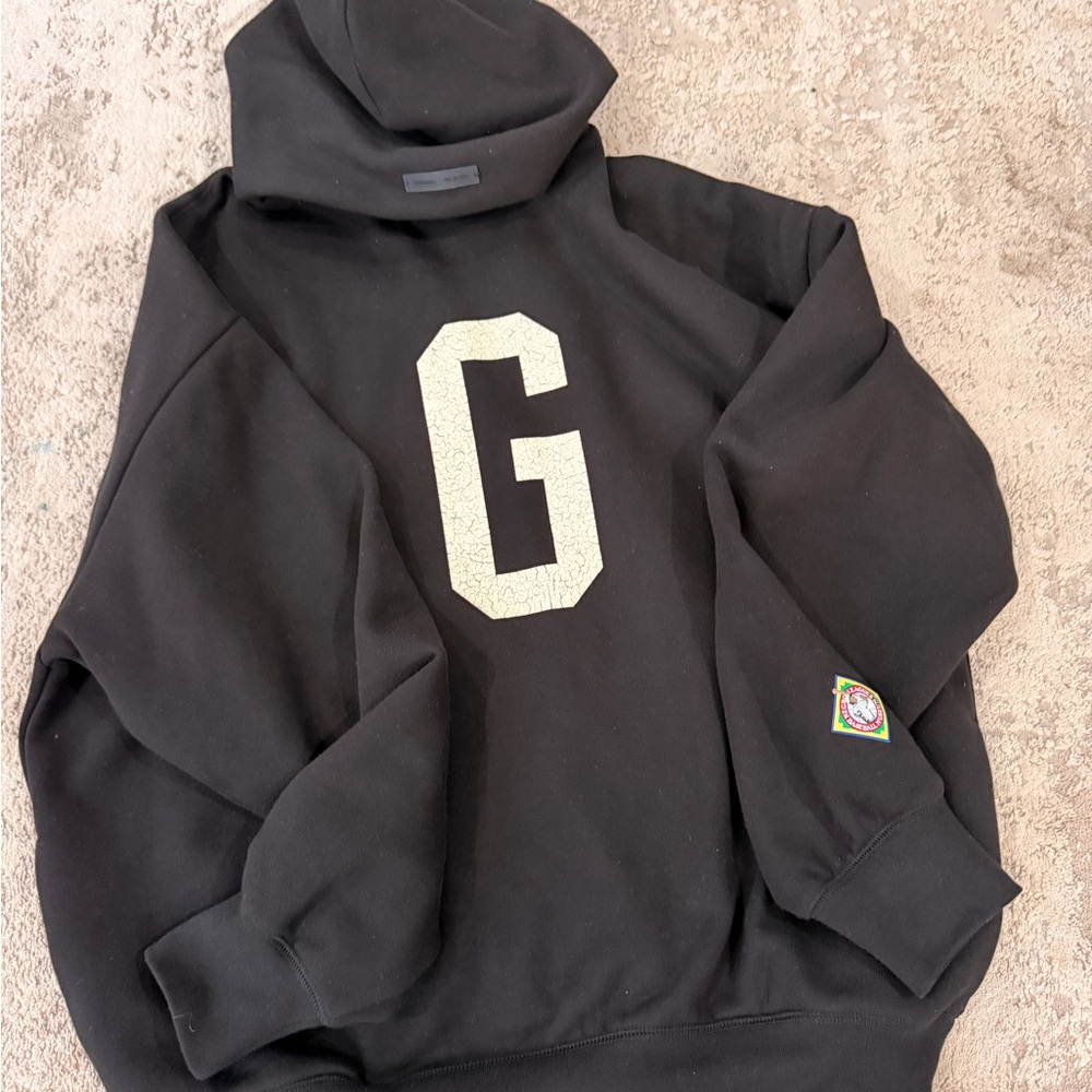 Fear of God Black Hoodie with Large 'G' Emblem